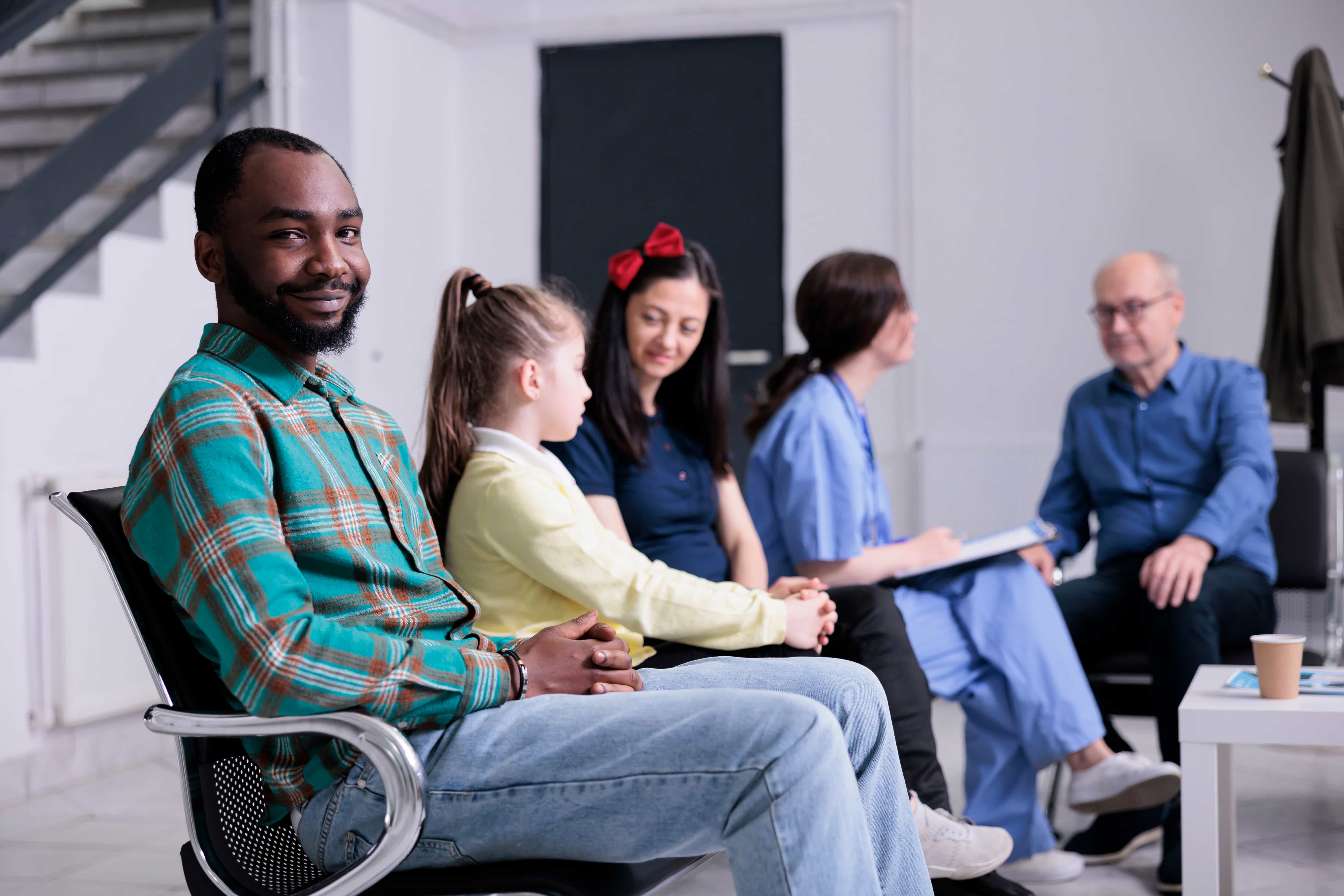 Family and care team seated together in a counseling room